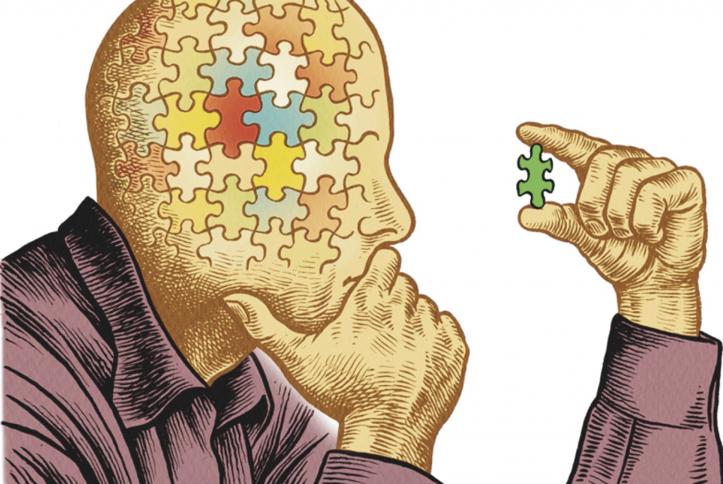 Header image. A man staring at a puzzle piece.